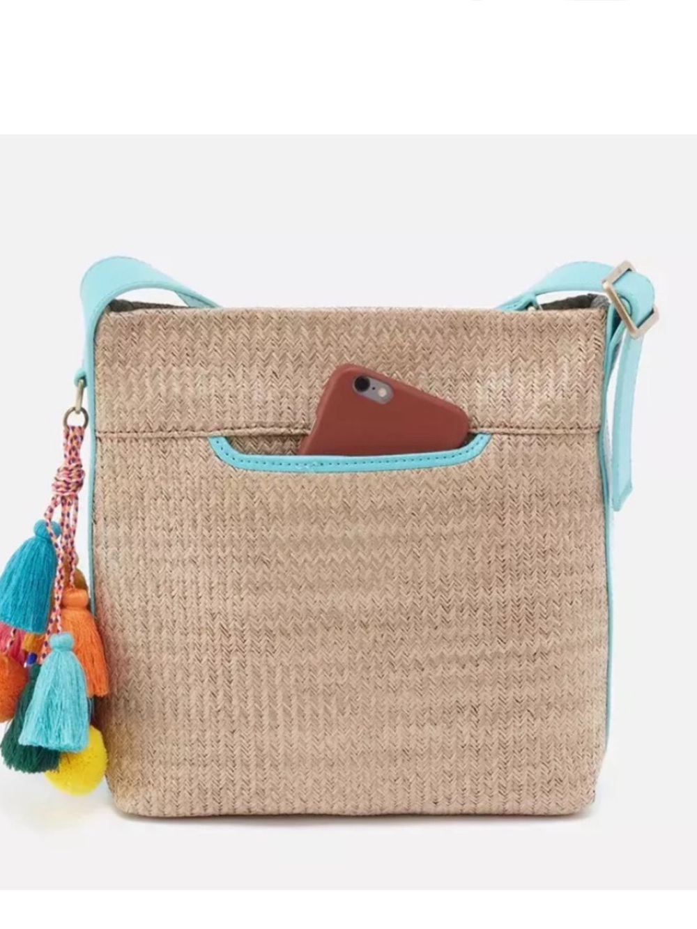 HOBO Blaze Bucket Crossbody Bag
Soft raffia Full grain leather trim Teal Tan